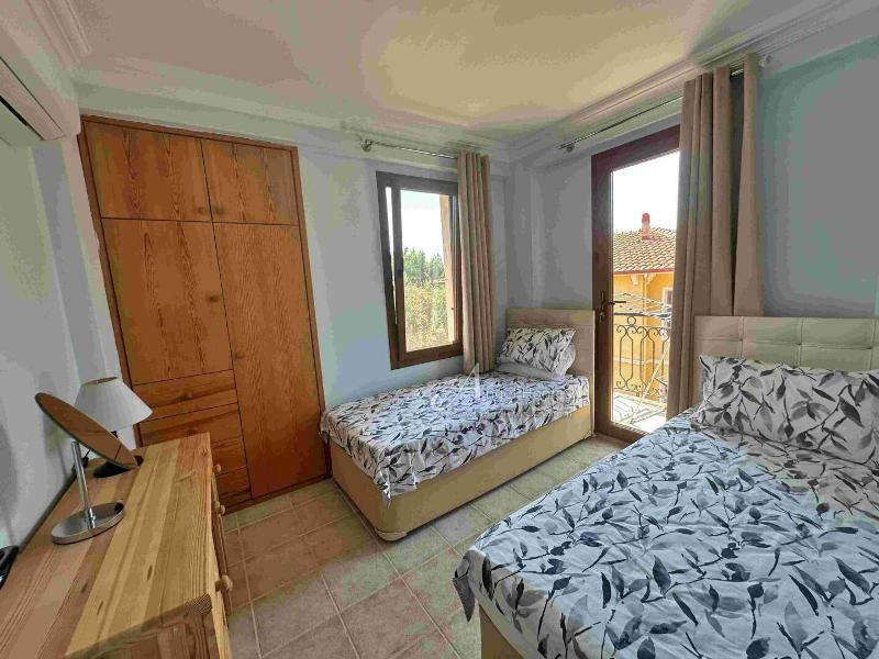 Bargain 2 Bedroom Furnished Property in Hisaronu Oludeniz Fethiye. Located in a gated complex with will landscaped green gardens and Large Shared Pool