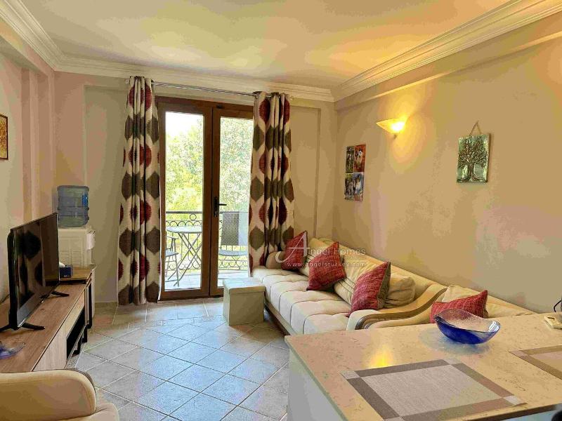 Bargain 2 Bedroom Furnished Property in Hisaronu Oludeniz Fethiye. Located in a gated complex with will landscaped green gardens and Large Shared Pool