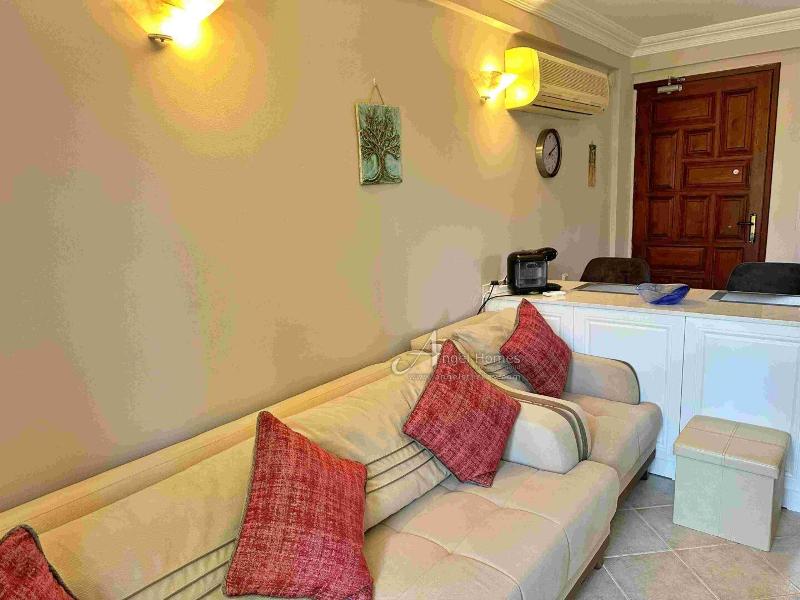 Bargain 2 Bedroom Furnished Property in Hisaronu Oludeniz Fethiye. Located in a gated complex with will landscaped green gardens and Large Shared Pool