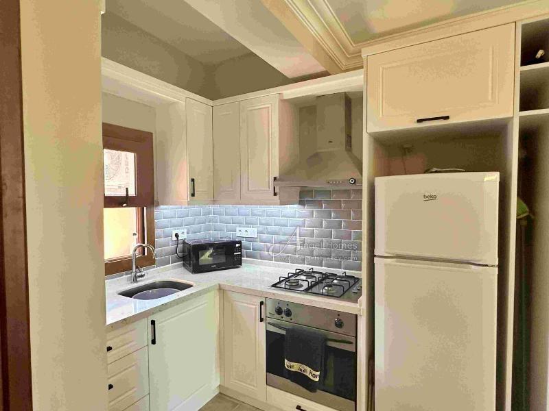 Bargain 2 Bedroom Furnished Property in Hisaronu Oludeniz Fethiye. Located in a gated complex with will landscaped green gardens and Large Shared Pool