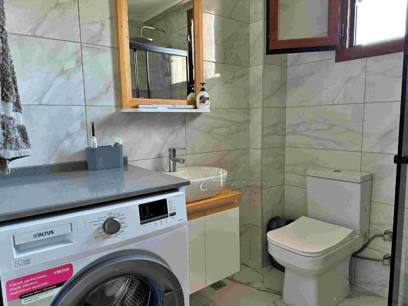 Bargain 2 Bedroom Furnished Property in Hisaronu Oludeniz Fethiye. Located in a gated complex with will landscaped green gardens and Large Shared Pool